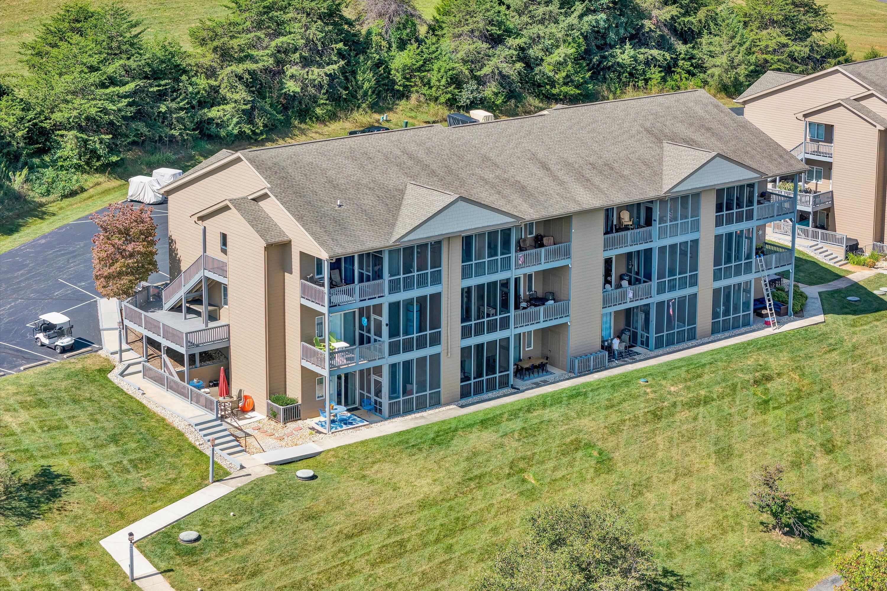 1175 Mariners Way, Unit 59 Huddleston, VA 24104 - Photo 27 of 44 a view of a house with a yard and potted plants