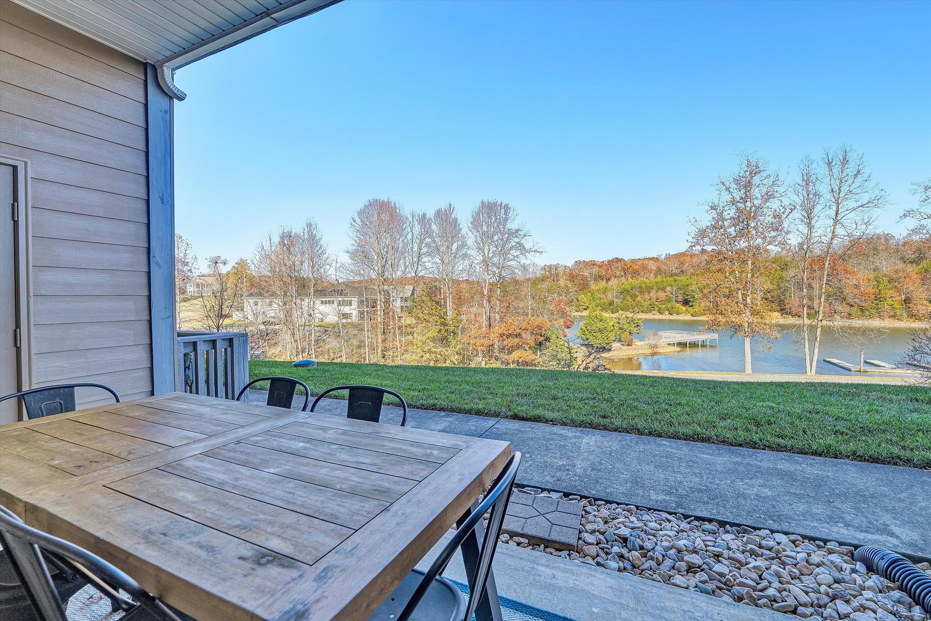 1175 Mariners Way, Unit 59 Huddleston, VA 24104 - Photo 30 of 44 a view of a patio with a table and chairs
