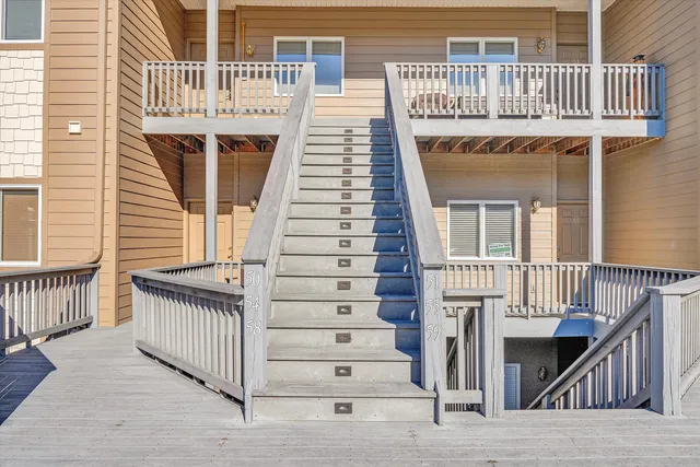 a front view of a house with a deck
