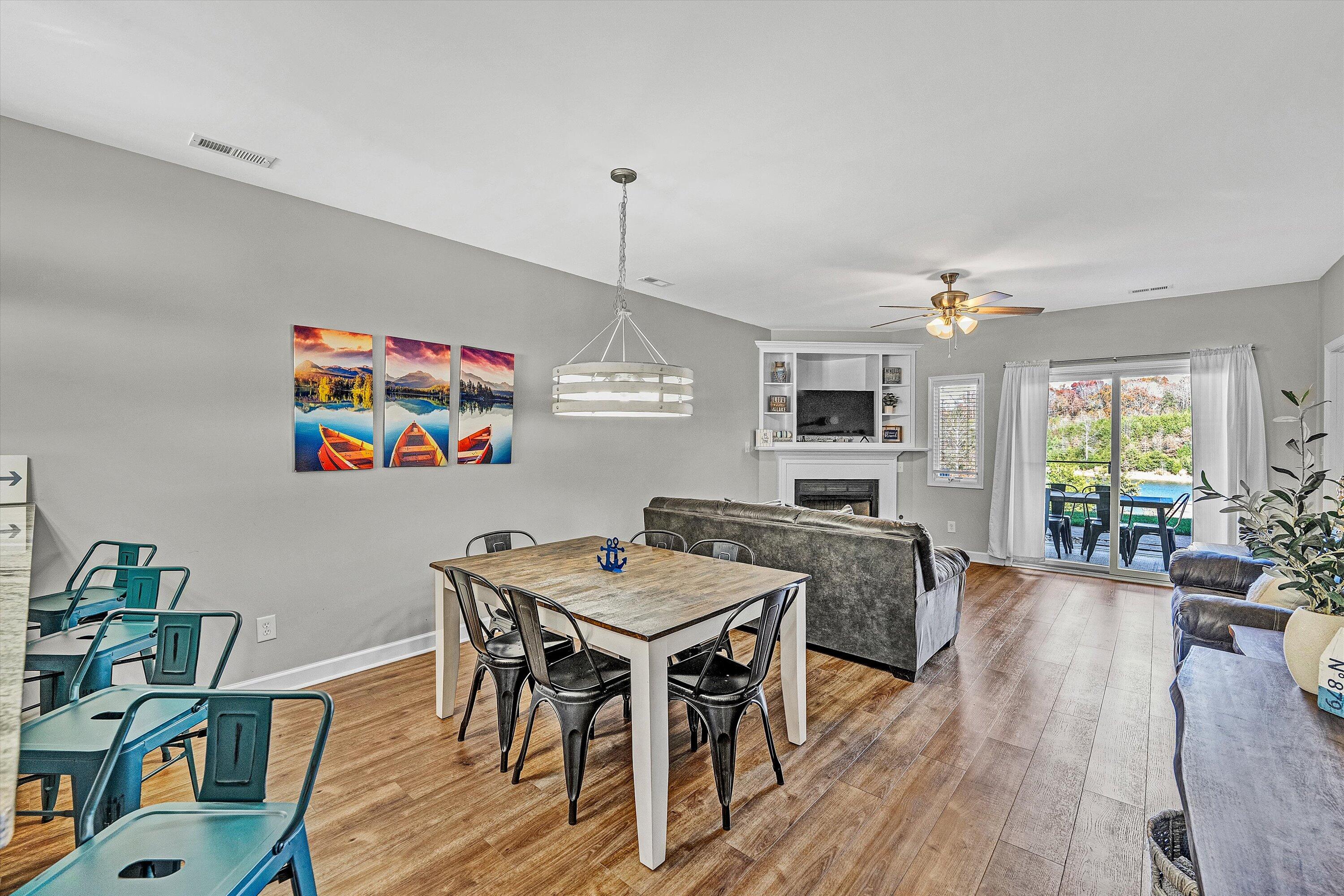 1175 Mariners Way, Unit 59 Huddleston, VA 24104 - Photo 9 of 44 a view of a dining room with furniture window and wooden floor