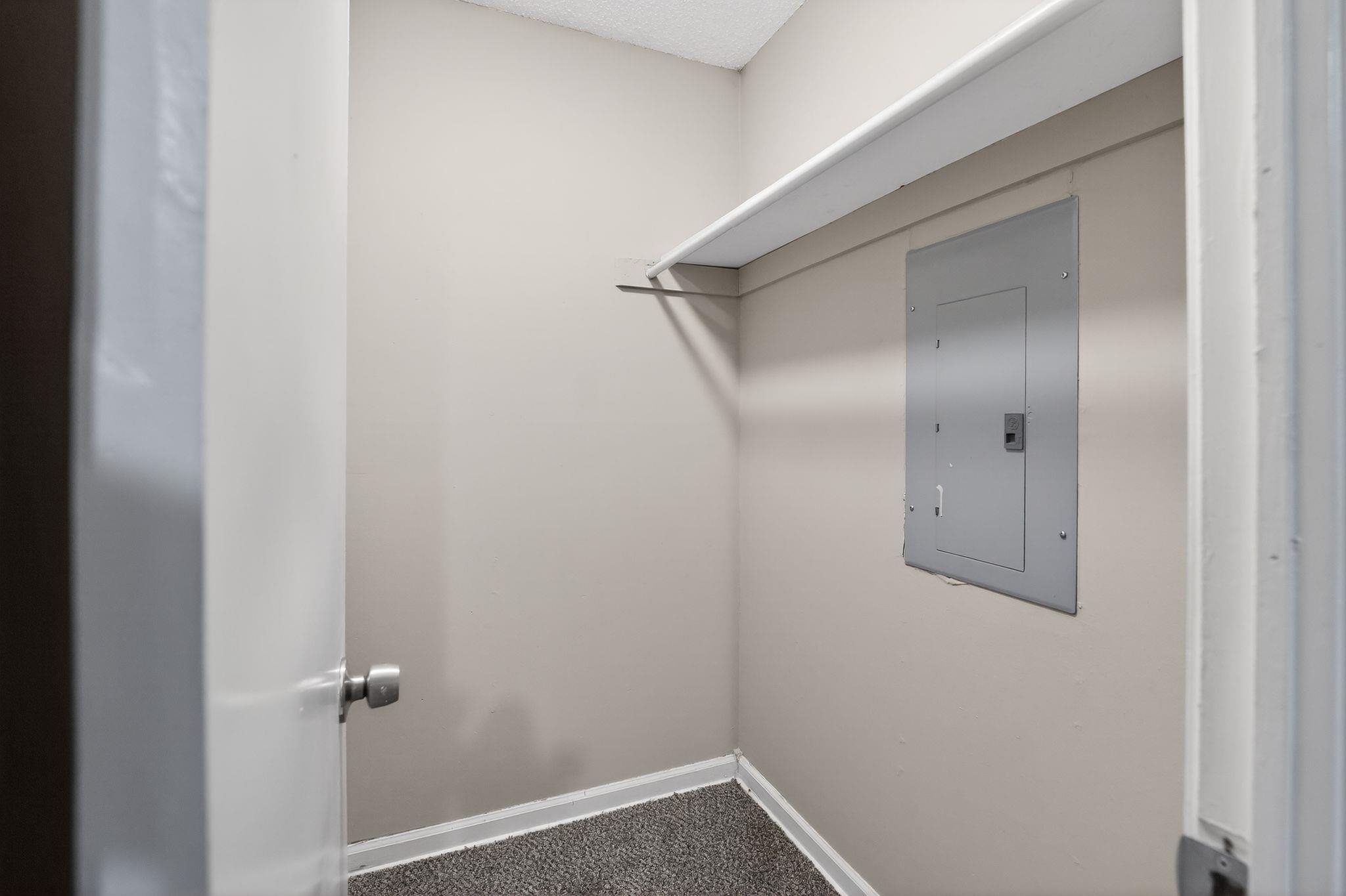 4725 Lofts Road Memphis, TN 38118 - Photo 25 of 32 Walk in closet with electric panel and dark colored carpet