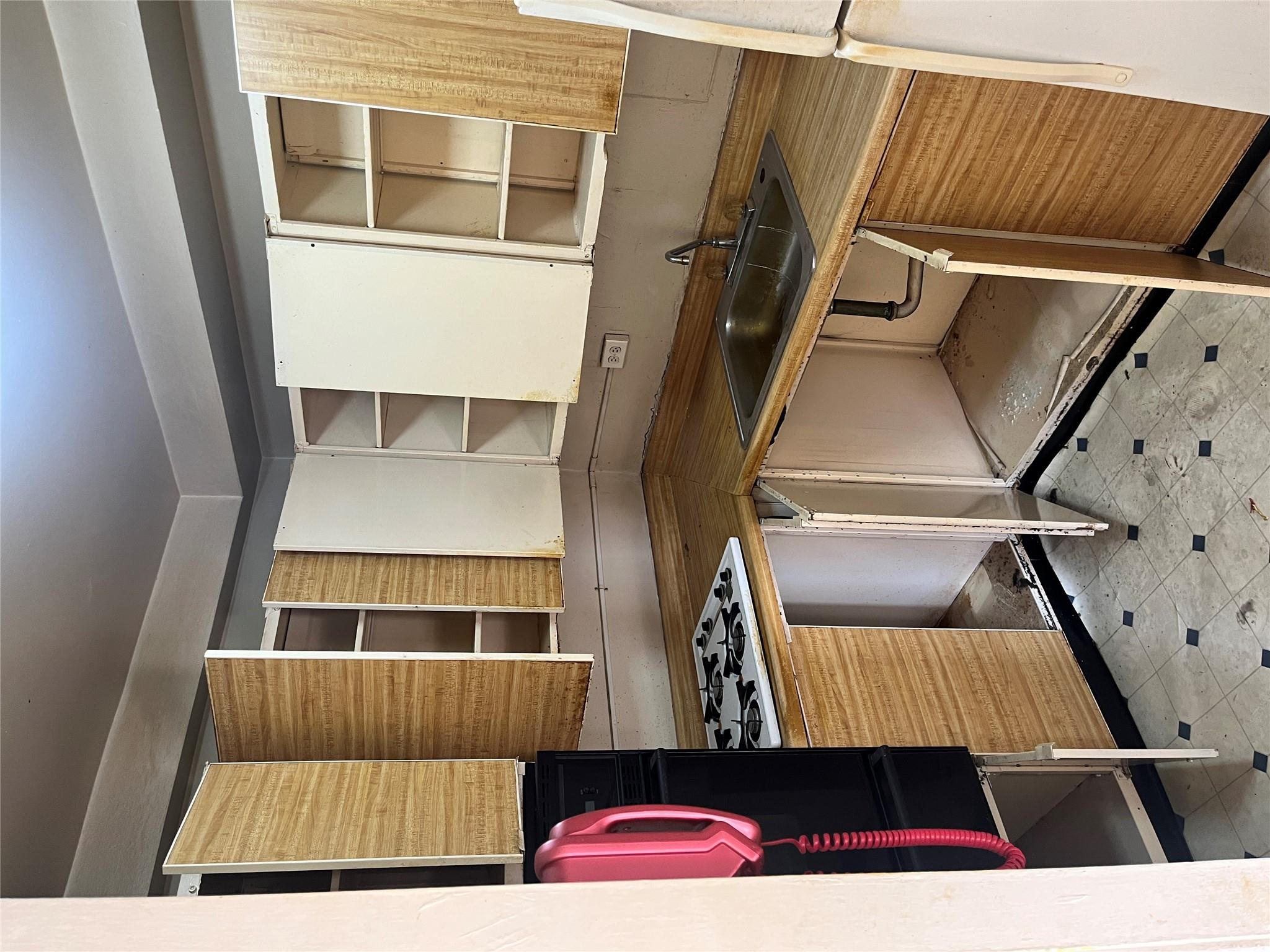 1020 Grand Concourse, Unit 23T Bronx, NY 10451 - Photo 2 of 13 Kitchen with cooktop, sink, oven, and fridge