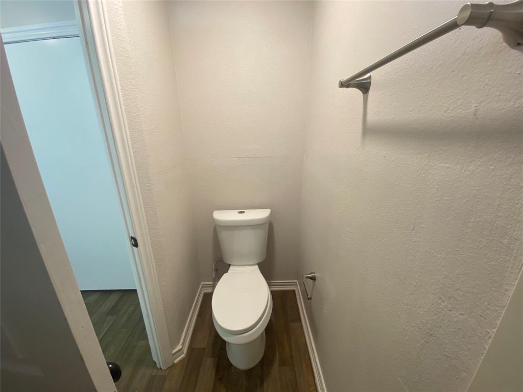810 Greenville Road McKinney, TX 75069 - Photo 17 of 21 a white toilet sitting next to a small sink