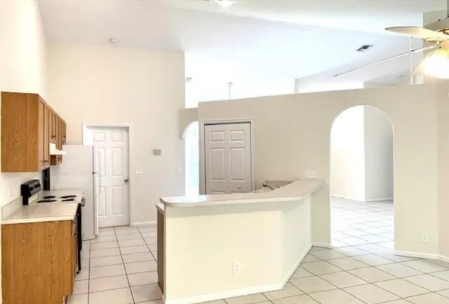 a room with a sink a washer and dryer