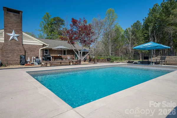 a patio with water table and chairs