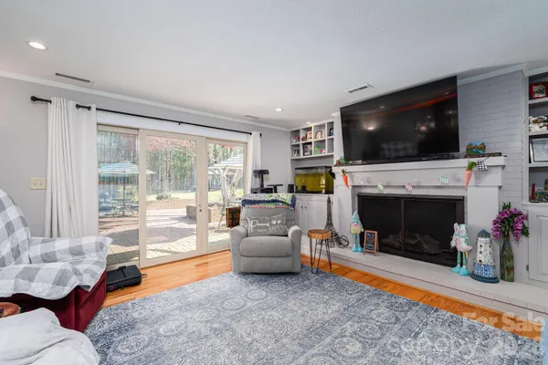 a view of a livingroom with furniture and hardwood floor