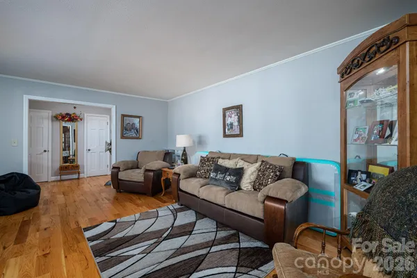 a bed room with furniture and a large window