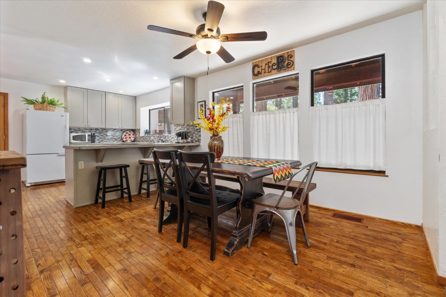 680 Larkspur Lane Murphys, CA 95247 - Photo 11 of 41 a view of a dining room with furniture window and wooden floor