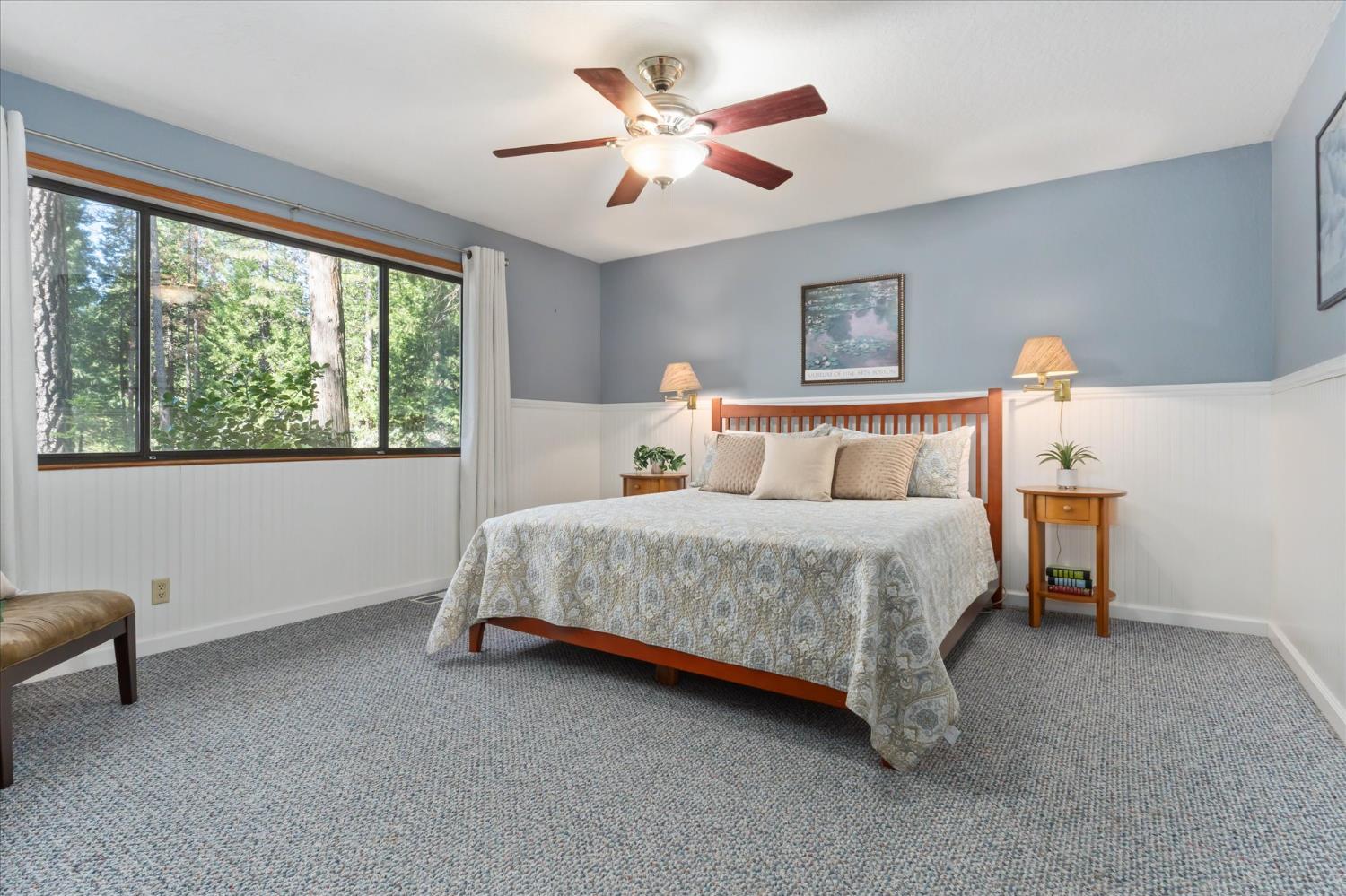 680 Larkspur Lane Murphys, CA 95247 - Photo 18 of 41 a bedroom with a bed and a large window