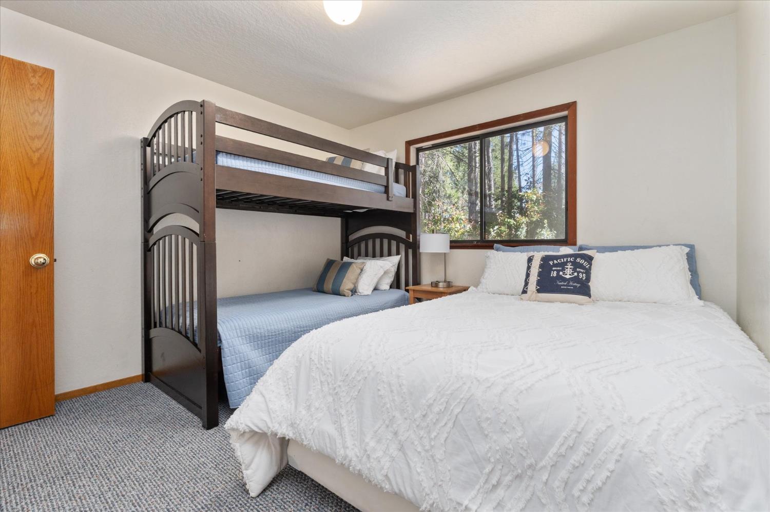 680 Larkspur Lane Murphys, CA 95247 - Photo 24 of 41 a bedroom with a bed and a large window