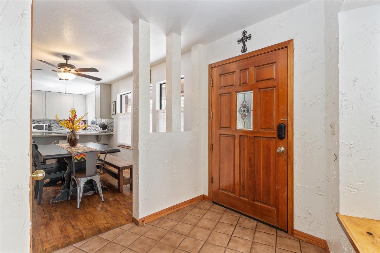 680 Larkspur Lane Murphys, CA 95247 - Photo 6 of 41 a view of a dining room with furniture and chandelier