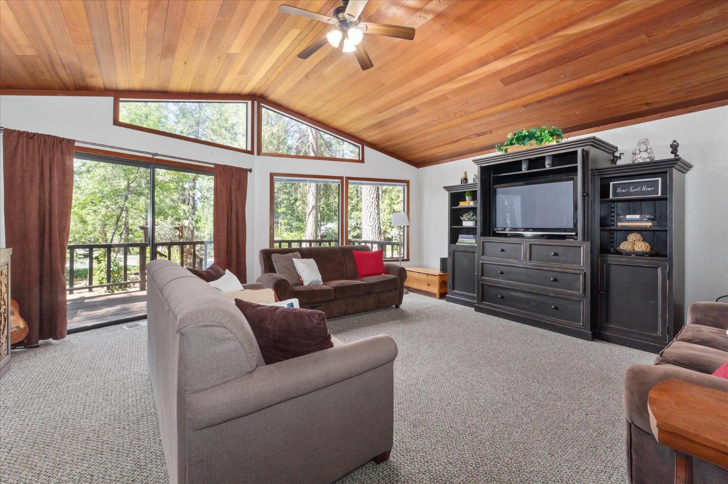 680 Larkspur Lane Murphys, CA 95247 - Photo 7 of 41 a living room with furniture and a flat screen tv