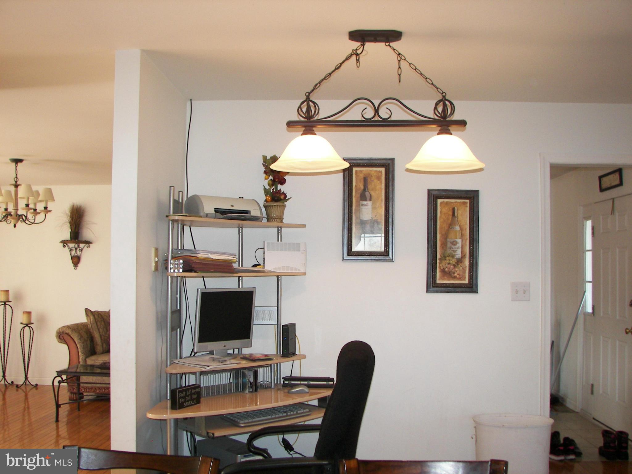 3619 Highland Ridge Road Berkeley Springs, WV 25411 - Photo 11 of 30 a view of a workspace with furniture and a window