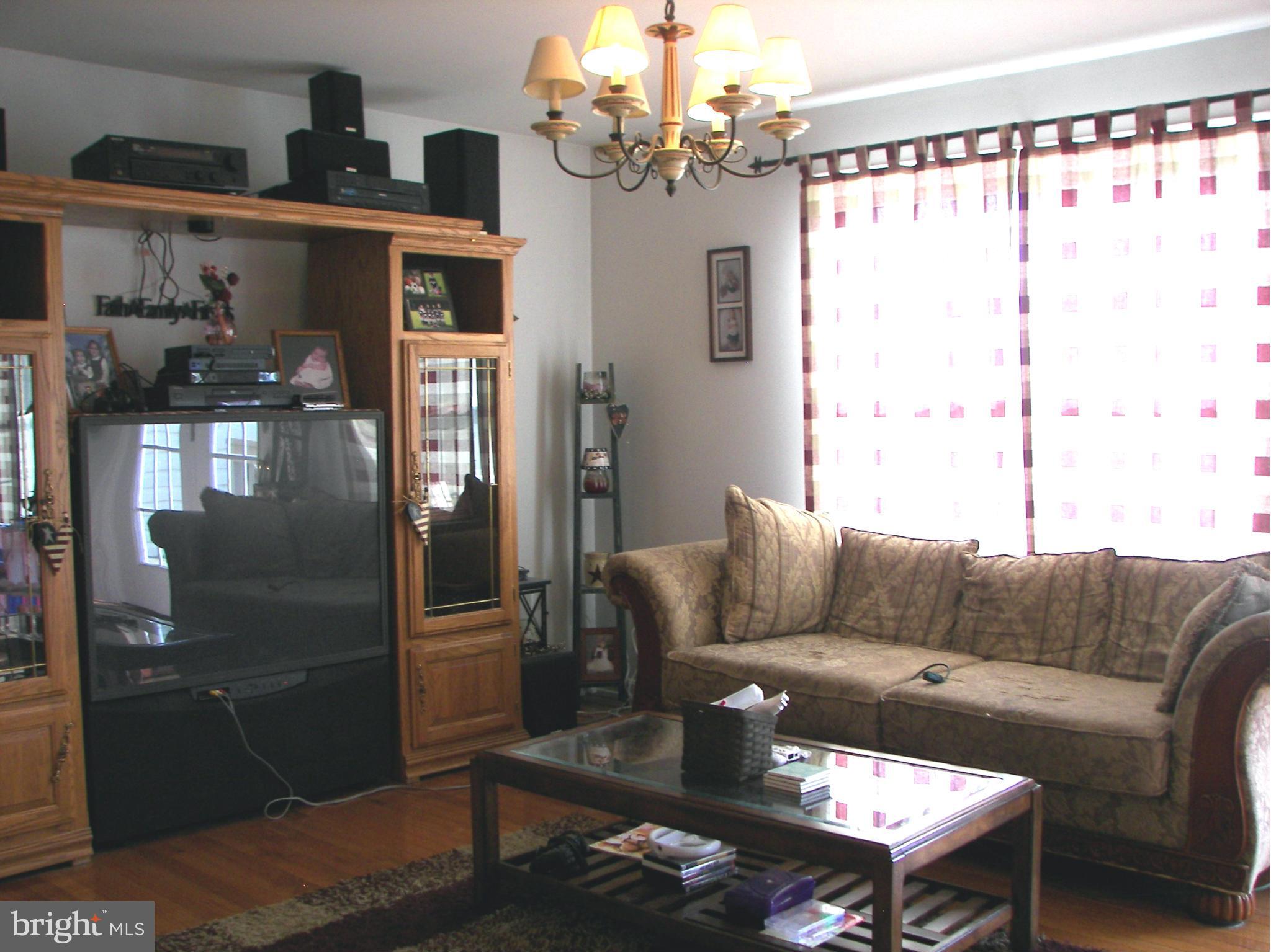 3619 Highland Ridge Road Berkeley Springs, WV 25411 - Photo 13 of 30 a living room with furniture and a window