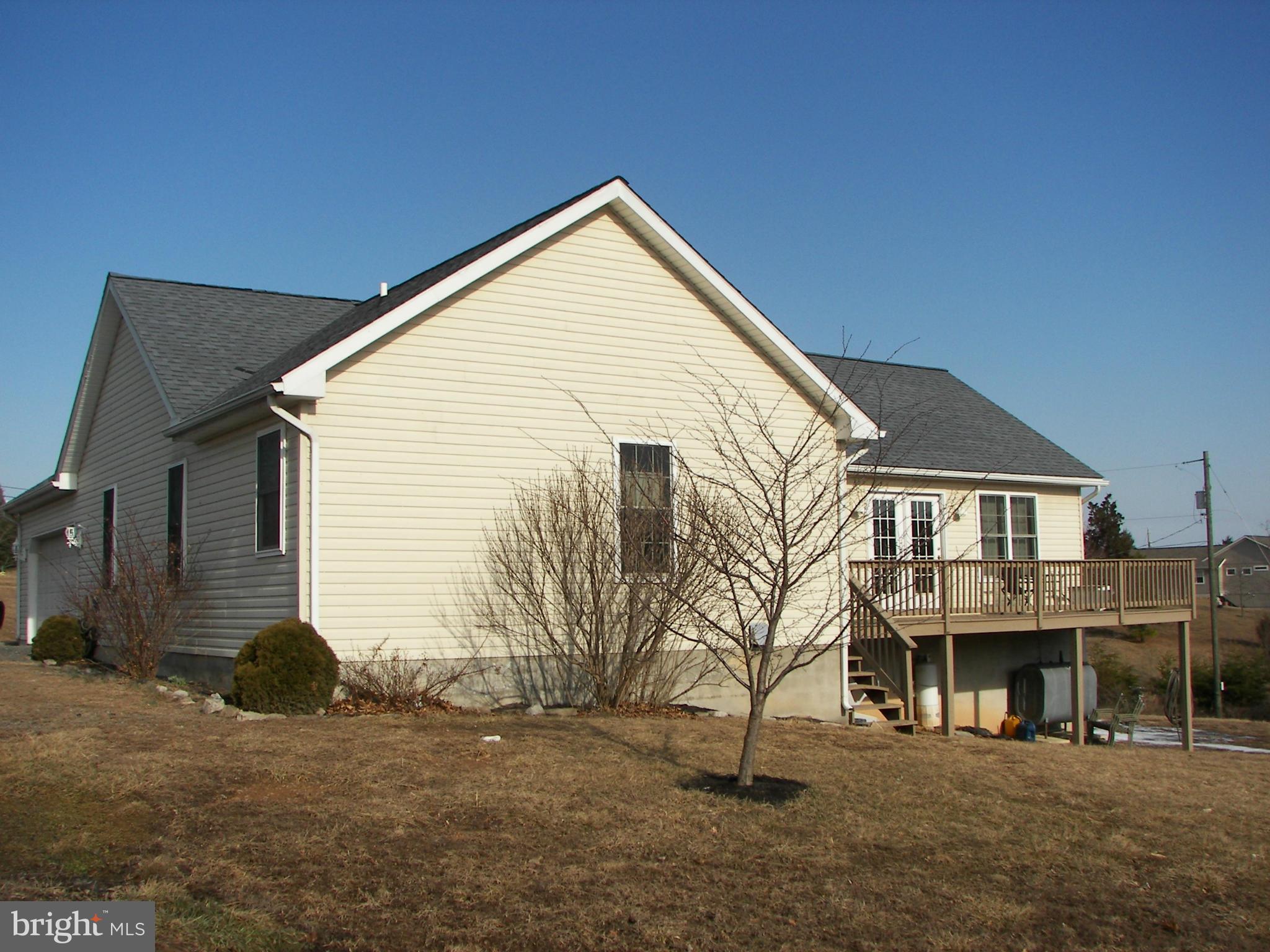 3619 Highland Ridge Road Berkeley Springs, WV 25411 - Photo 3 of 30 a view of a house with a yard