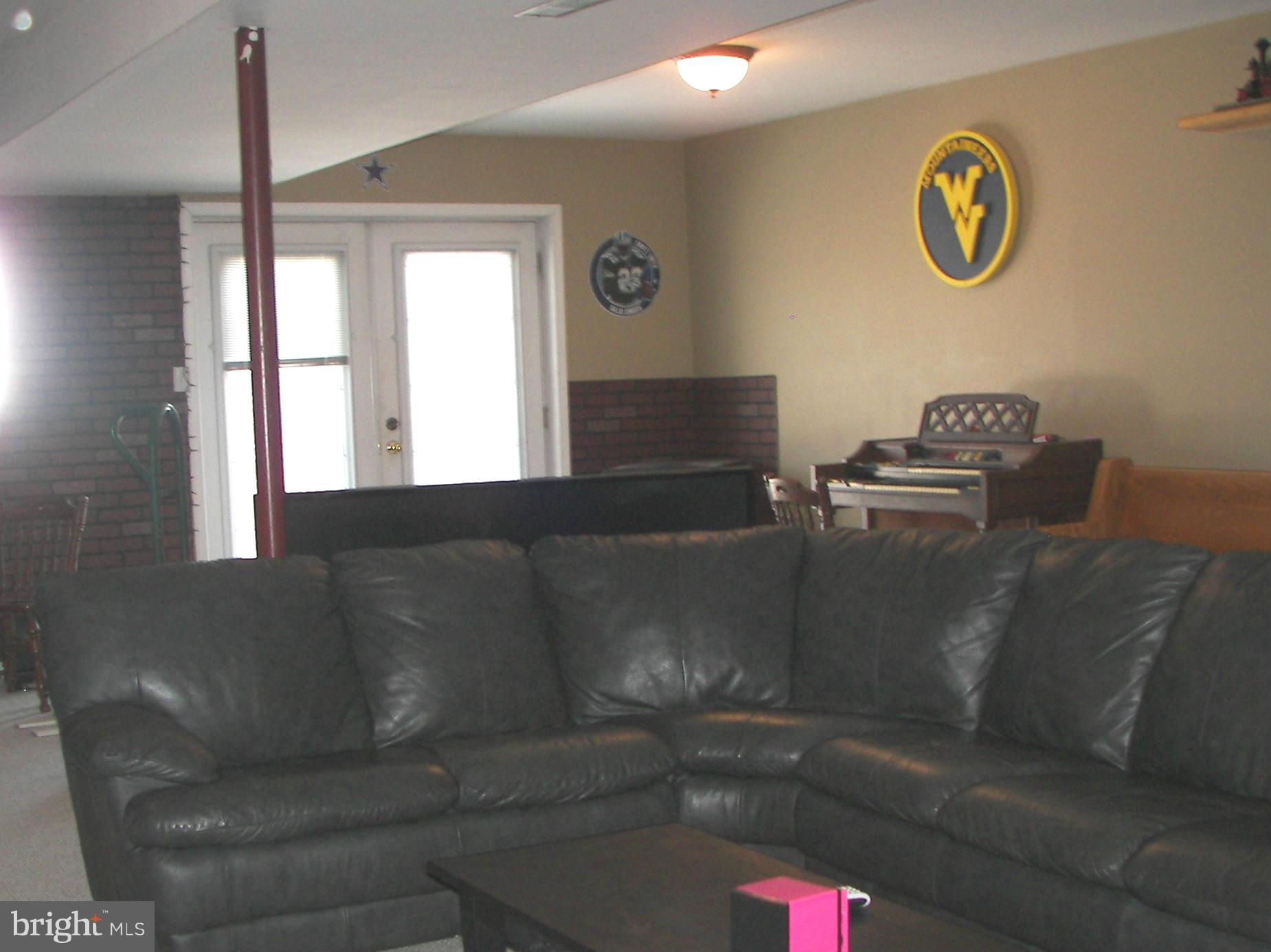 3619 Highland Ridge Road Berkeley Springs, WV 25411 - Photo 25 of 30 a living room with couch and window