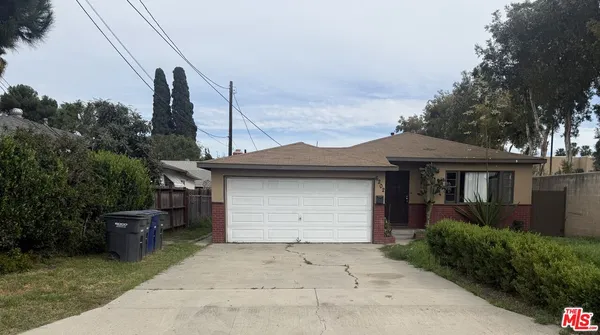 a front view of a house with a garage