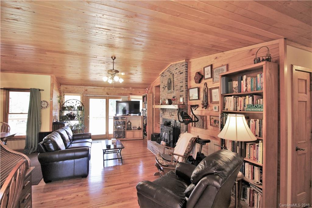 1775 Ebenezer Road Smyrna, SC 29743 - Photo 8 of 36 a living room with furniture or chandelier and a wooden floor