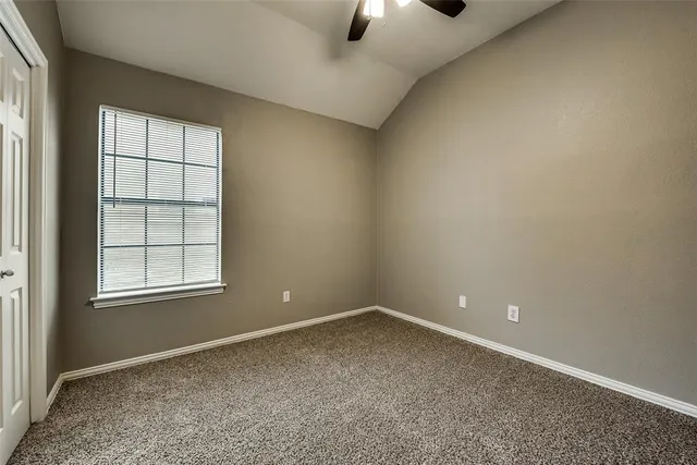 an empty room with a empty space and windows
