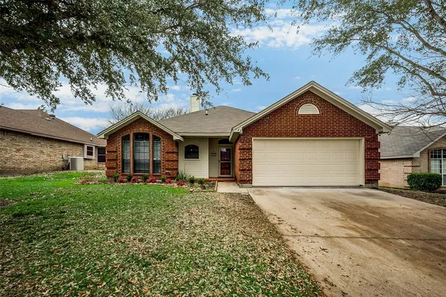 a front view of a house with yard
