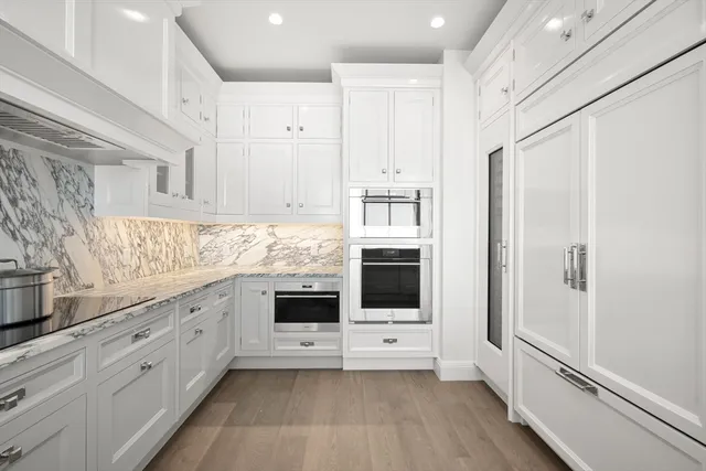 a kitchen with stainless steel appliances a refrigerator sink and cabinets