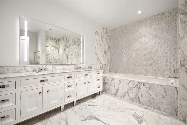 a bathroom with a granite countertop sink mirror and a
