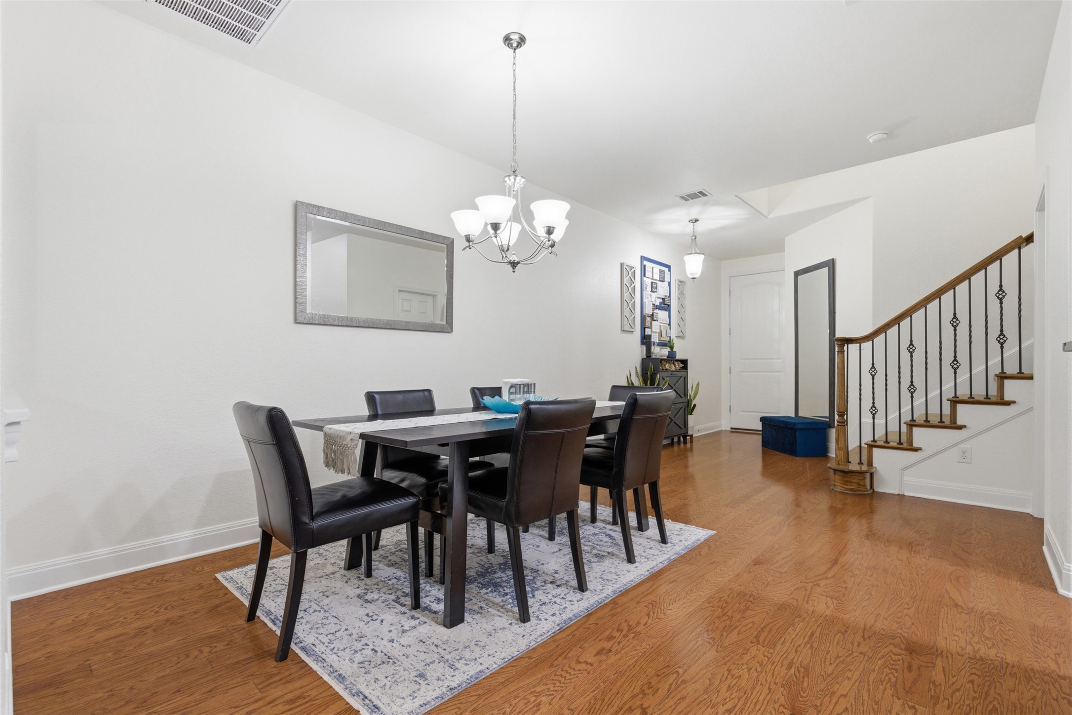 15331 Origins Lane Austin, TX 78734 - Photo 11 of 30 a view of a dining room with furniture and chandelier