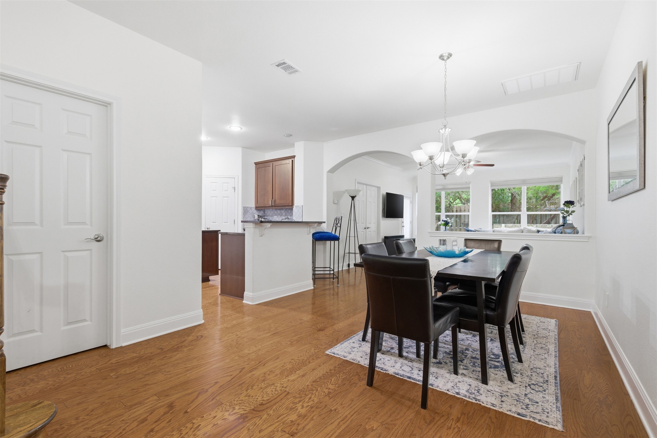15331 Origins Lane Austin, TX 78734 - Photo 12 of 30 a view of a dining room with furniture and wooden floor