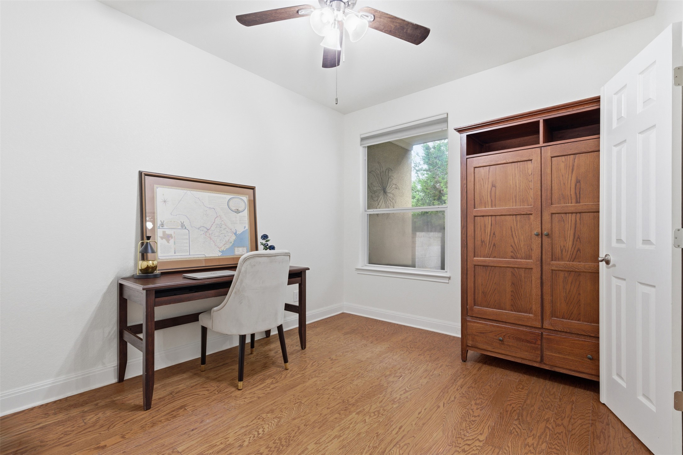15331 Origins Lane Austin, TX 78734 - Photo 13 of 30 a room with furniture and a window
