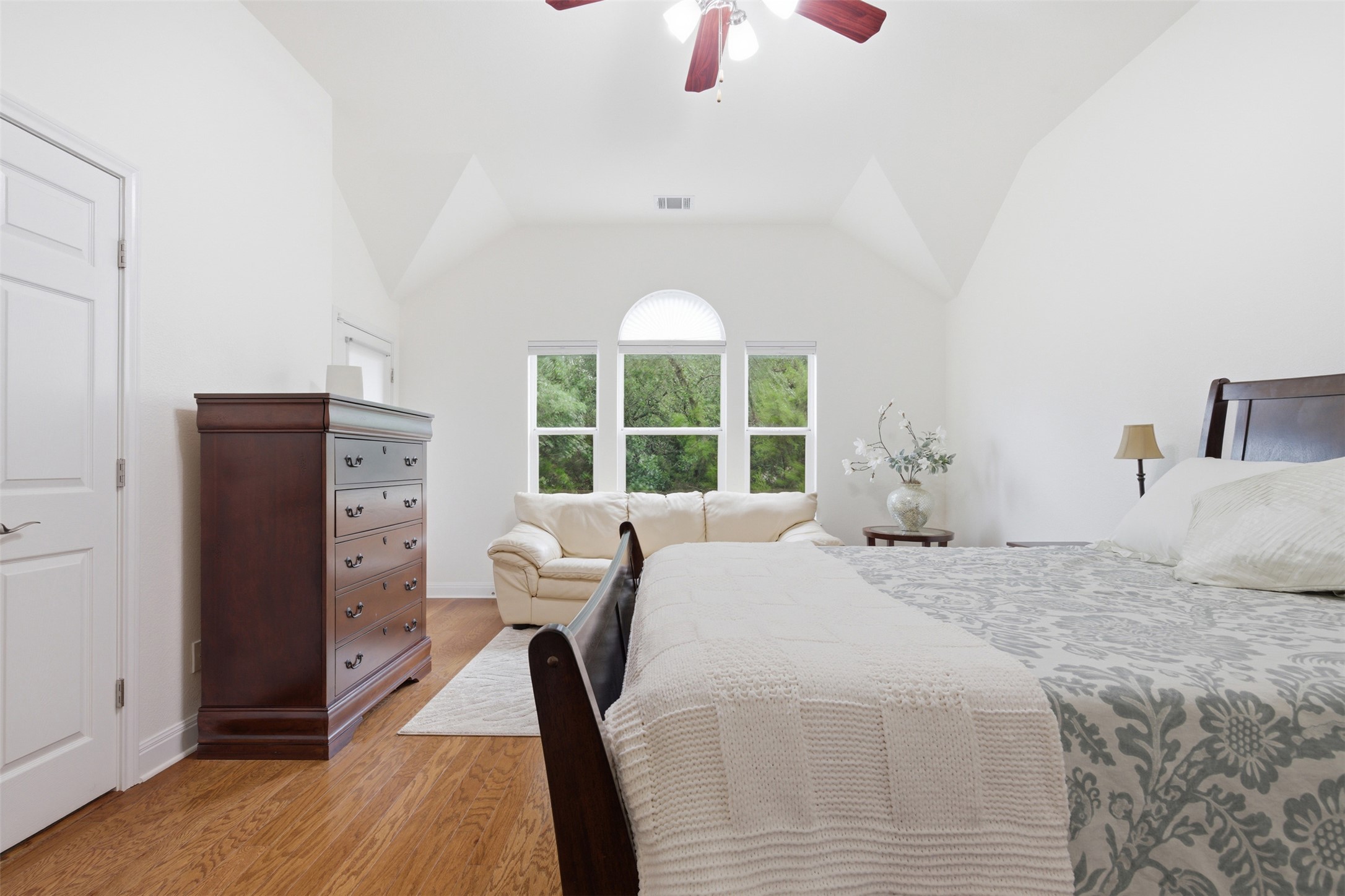 15331 Origins Lane Austin, TX 78734 - Photo 17 of 30 a bedroom with a bed and a large window