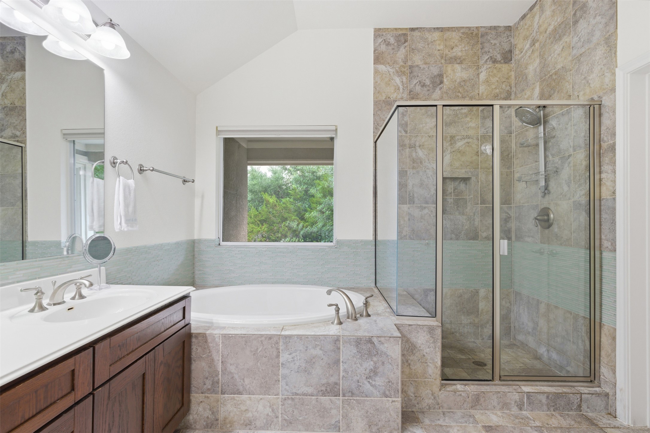 15331 Origins Lane Austin, TX 78734 - Photo 19 of 30 a bathroom with a bathtub and a shower