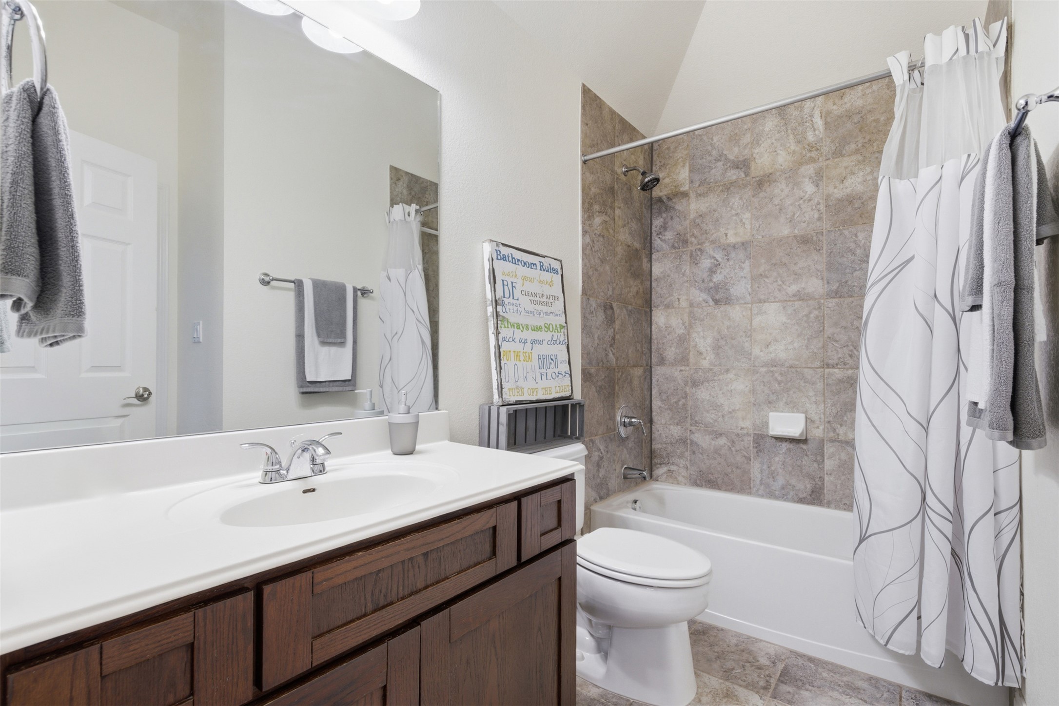 15331 Origins Lane Austin, TX 78734 - Photo 21 of 30 a bathroom with a sink a toilet and shower