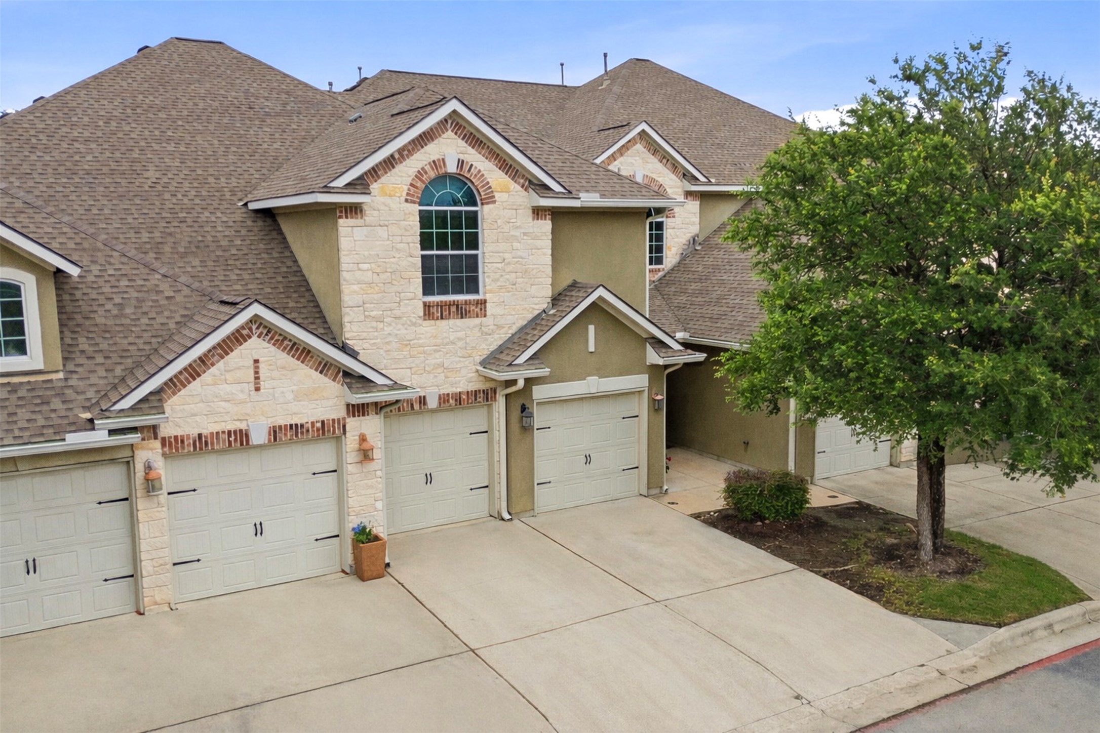 15331 Origins Lane Austin, TX 78734 - Photo 27 of 30 front view of a house with a yard and potted plants