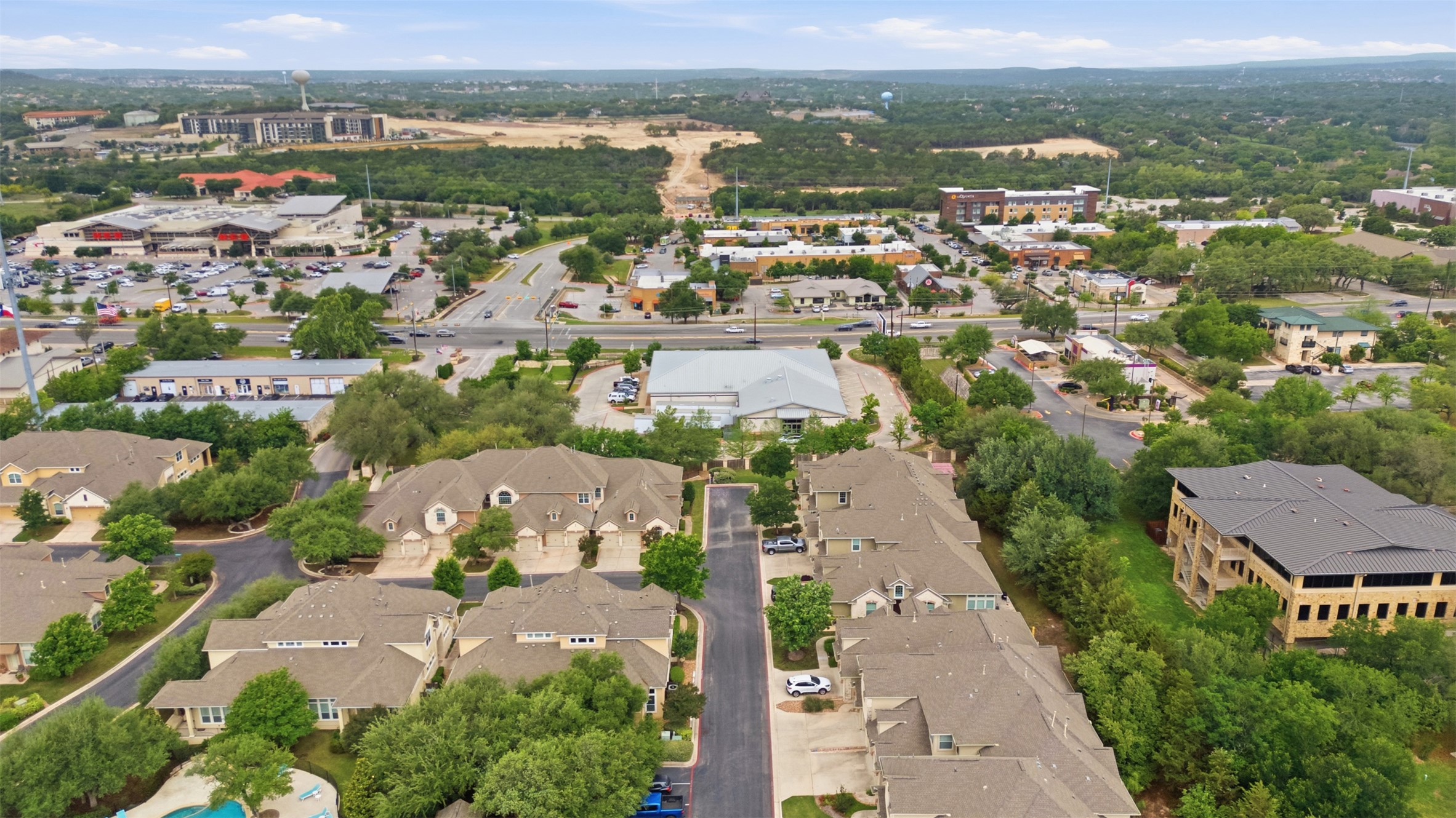 15331 Origins Lane Austin, TX 78734 - Photo 28 of 30 an aerial view of a city with lots of residential buildings