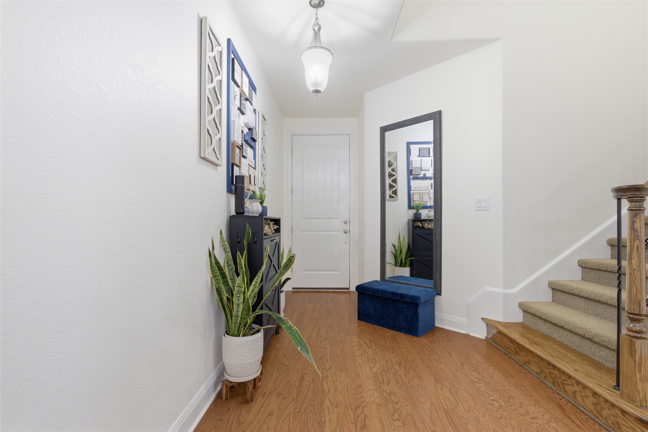15331 Origins Lane Austin, TX 78734 - Photo 3 of 30 a view of a hallway with a potted plant