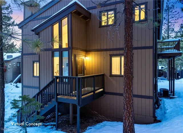 a view of entryway with a front door and wooden floor
