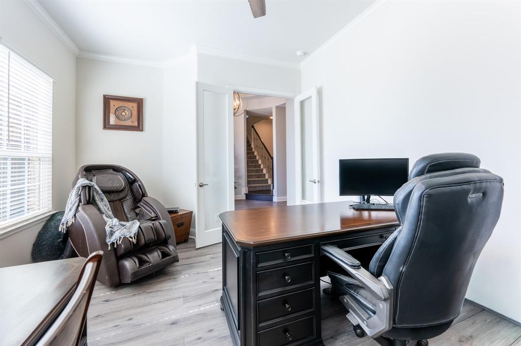 1316 Kirkwood Road Rockwall, TX 75087 - Photo 16 of 37 a view of a workspace with furniture and a window