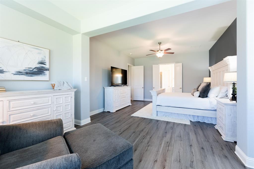 1316 Kirkwood Road Rockwall, TX 75087 - Photo 19 of 37 a living room with furniture and a fireplace