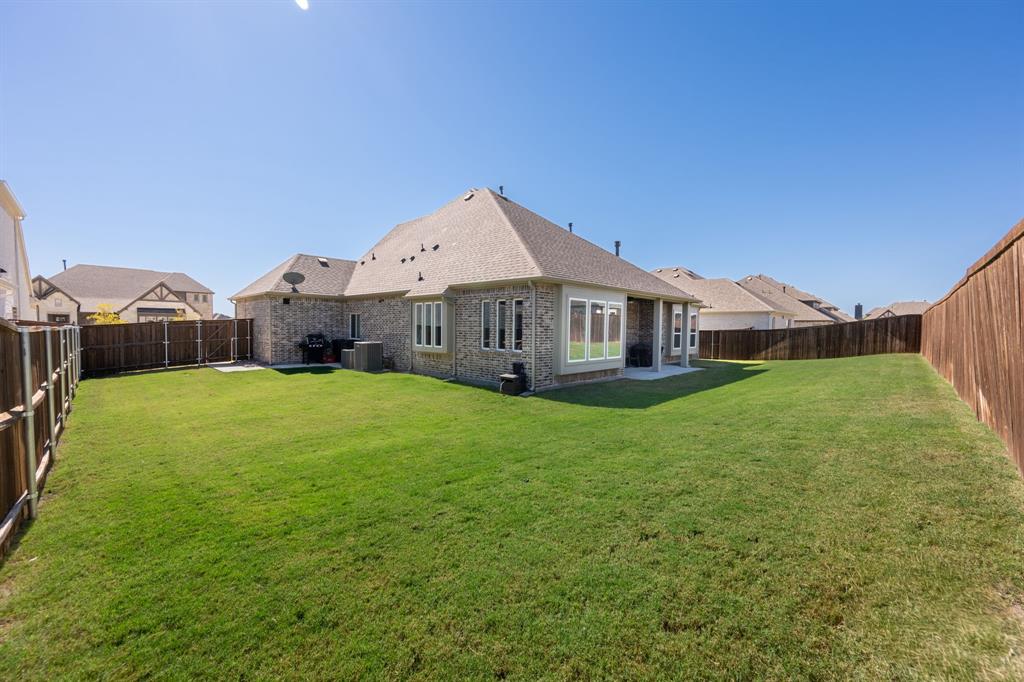 1316 Kirkwood Road Rockwall, TX 75087 - Photo 35 of 37 a front view of a house with garden