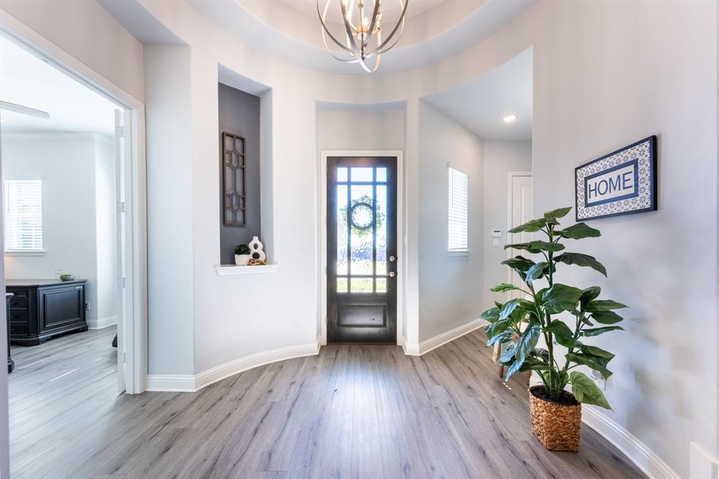1316 Kirkwood Road Rockwall, TX 75087 - Photo 4 of 37 a view of an entryway with wooden floor
