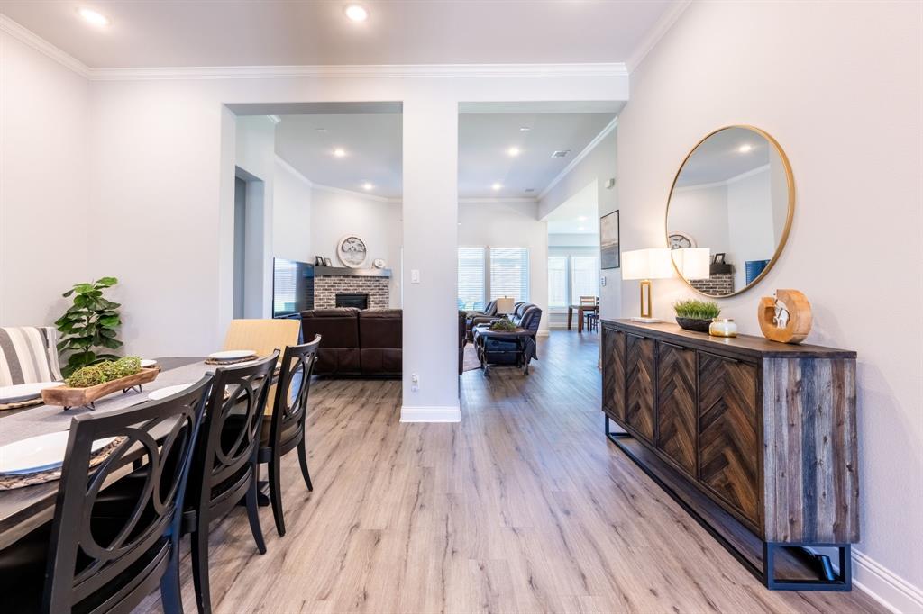 1316 Kirkwood Road Rockwall, TX 75087 - Photo 6 of 37 a view of a dining room with furniture window and wooden floor