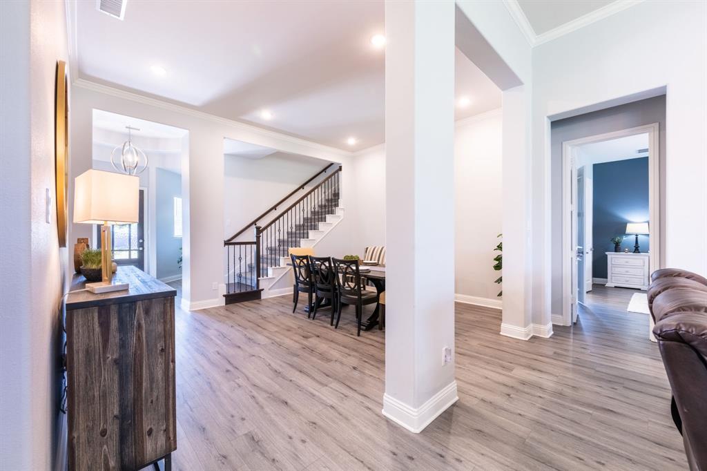 1316 Kirkwood Road Rockwall, TX 75087 - Photo 9 of 37 a view of entryway and dining room with wooden floor
