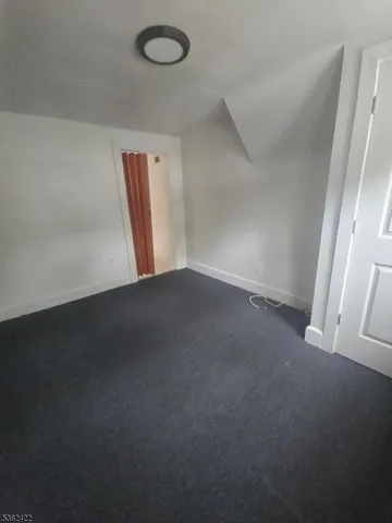 a view of an empty room and a window