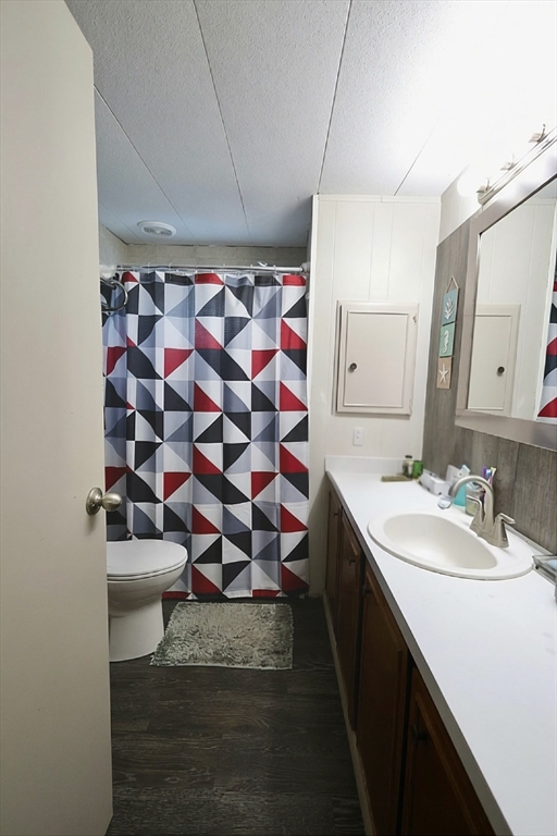 42 Better Way Springfield, MA 01119 - Photo 14 of 18 a bathroom with a sink mirror and vanity