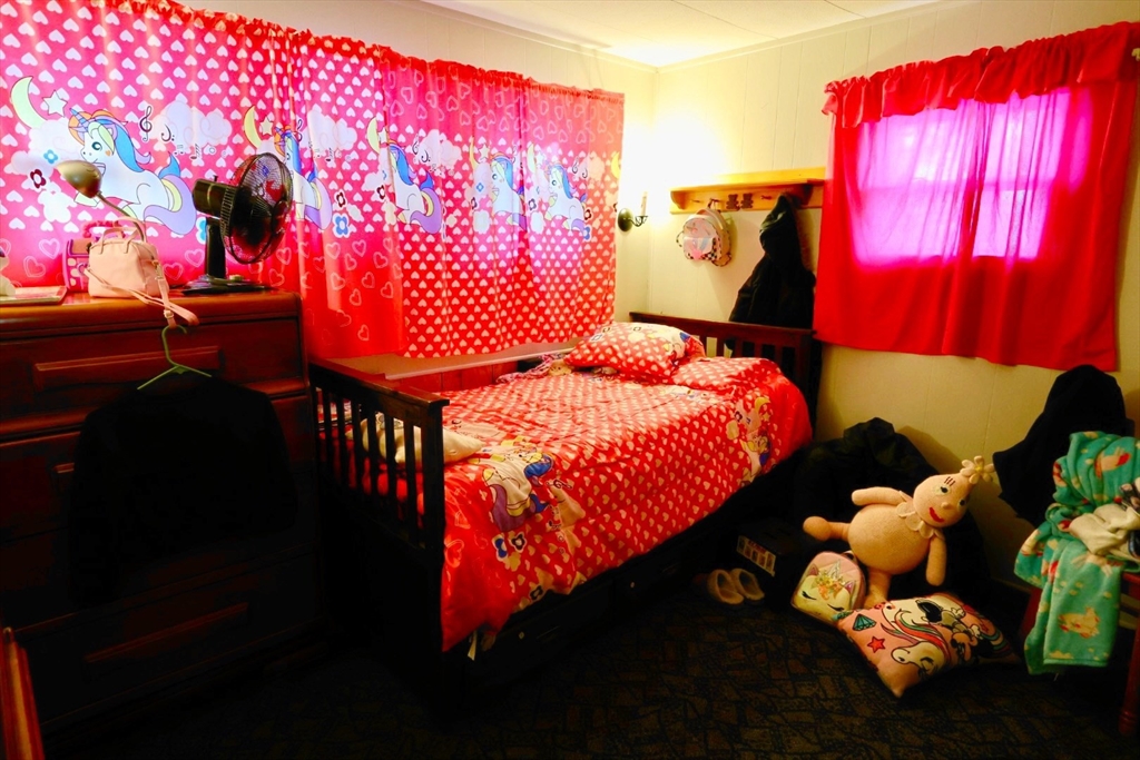 42 Better Way Springfield, MA 01119 - Photo 17 of 18 a bed room with a bed and a couch