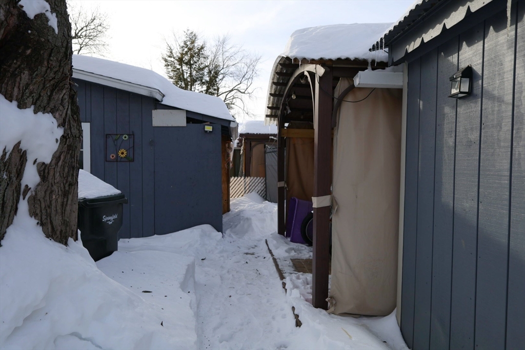 42 Better Way Springfield, MA 01119 - Photo 4 of 18 a view of walk in closet with clothes and shoes