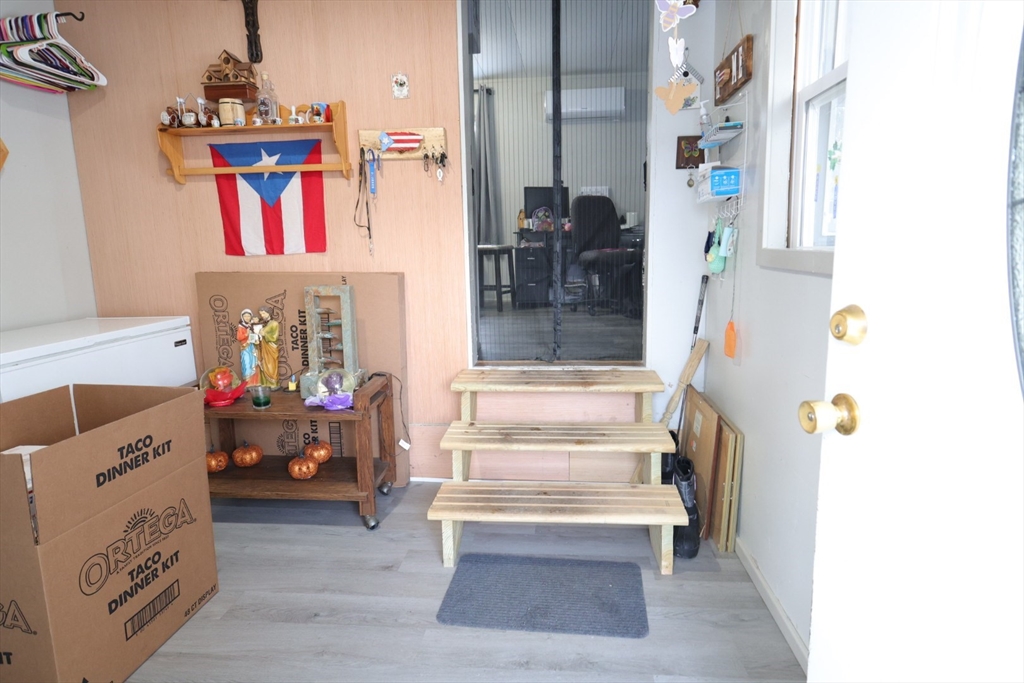 42 Better Way Springfield, MA 01119 - Photo 7 of 18 a view of living room with baby crib and furniture
