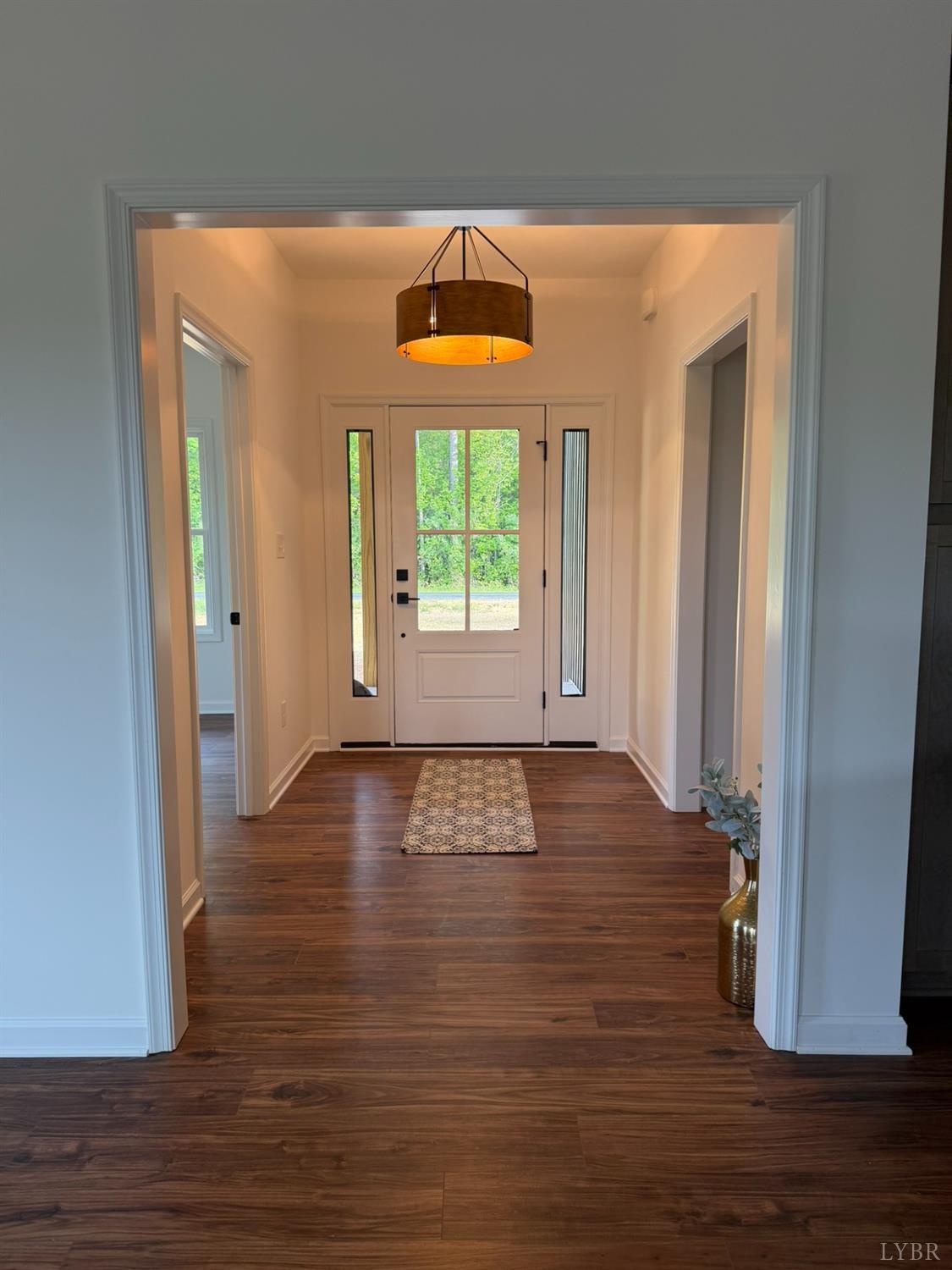 405 Hixburg Road Pamplin, VA 23958 - Photo 10 of 73 a view of an empty room with wooden floor and a window