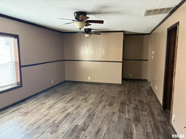 a view of a livingroom with wooden floor