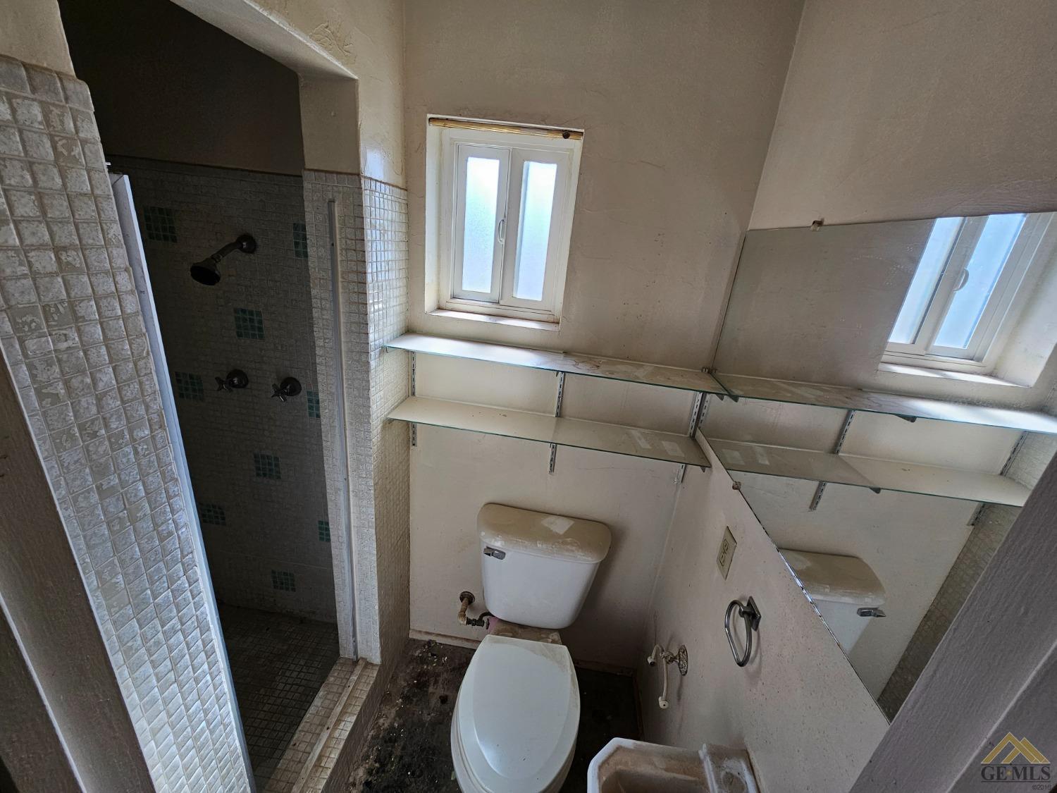 Undisclosed Address Taft, CA 93268 - Photo 11 of 20 a bathroom with a toilet and a shower